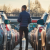 A customer exploring the R&B Car Company Fort Wayne lot, looking at a lineup of quality used vehicles.