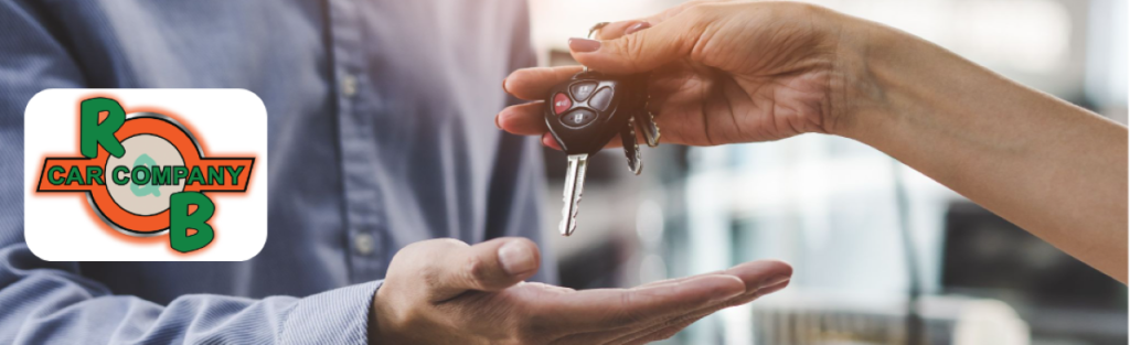A customer receiving keys to their new car.