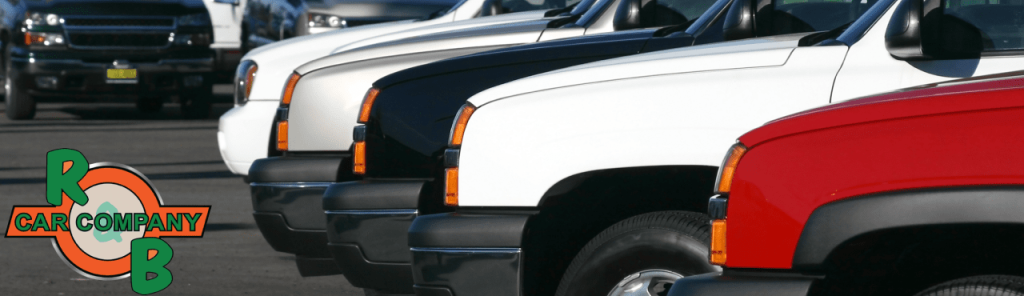 R&B Car Company trucks for sale up lined up outside their dealership.