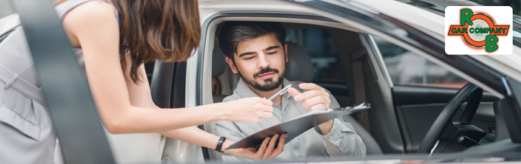 Customer receiving a same-day cash offer for their used car at R&B Car Company Fort Wayne.