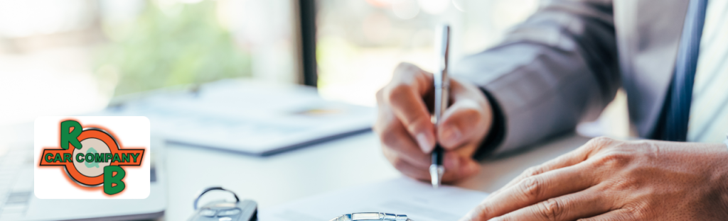 Customer exploring used Ford F-150 and Chevy Silverado trucks at R&B Car Company, Fort Wayne.