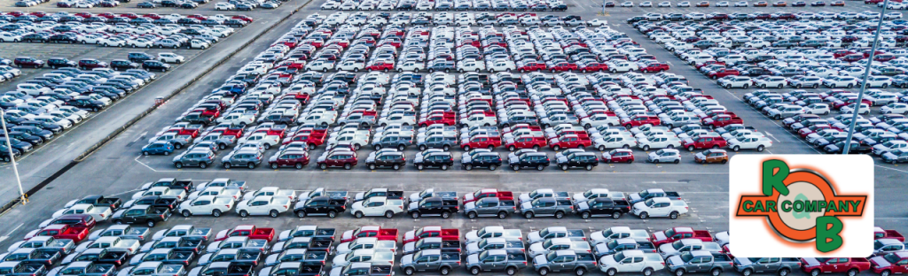  A lineup of quality used vehicles at R&B Car Company Fort Wayne dealership lot under sunny skies.
