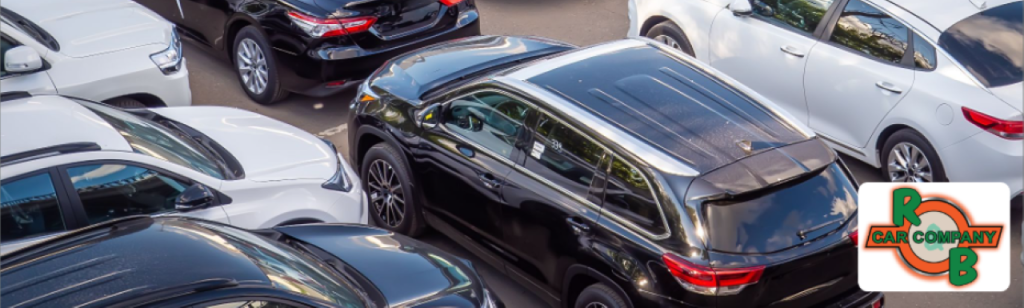 Close-up of a happy customer receiving keys to a certified pre-owned vehicle from a sales associate at R&B Car Company Fort Wayne.
