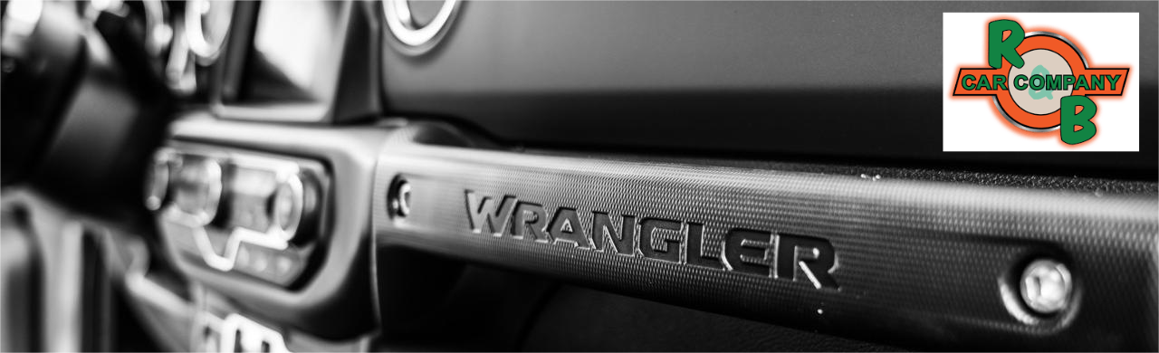 Interior cabin view of a Jeep Wrangler showing modern dashboard and seating features.